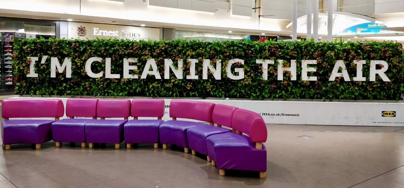 A prominent sign stating "I'm cleaning the air," emphasizing environmental awareness and air quality improvement.
