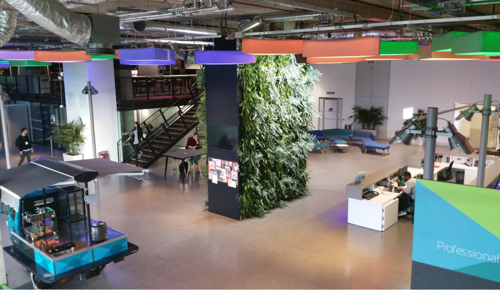 living wall office view wide cart people